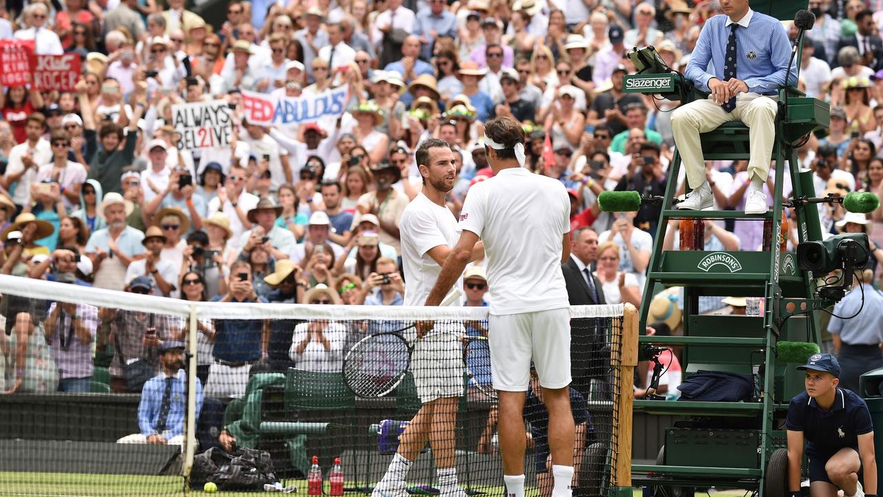 Familiar sight. Roger Federer shakes Adrian Mannarino’s hand after winning their fourth round match.