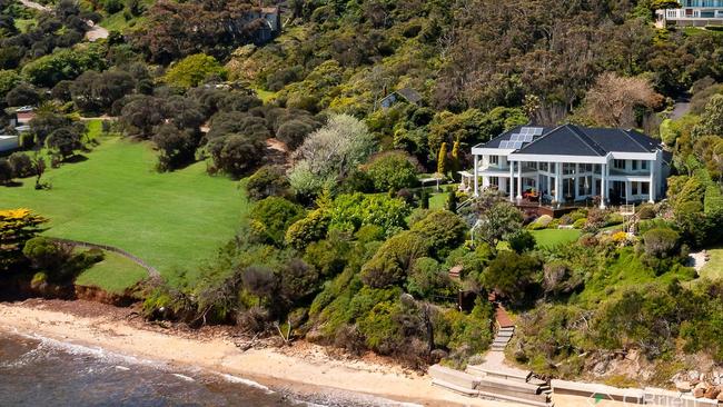 The sand is just metres from the home’s back deck.