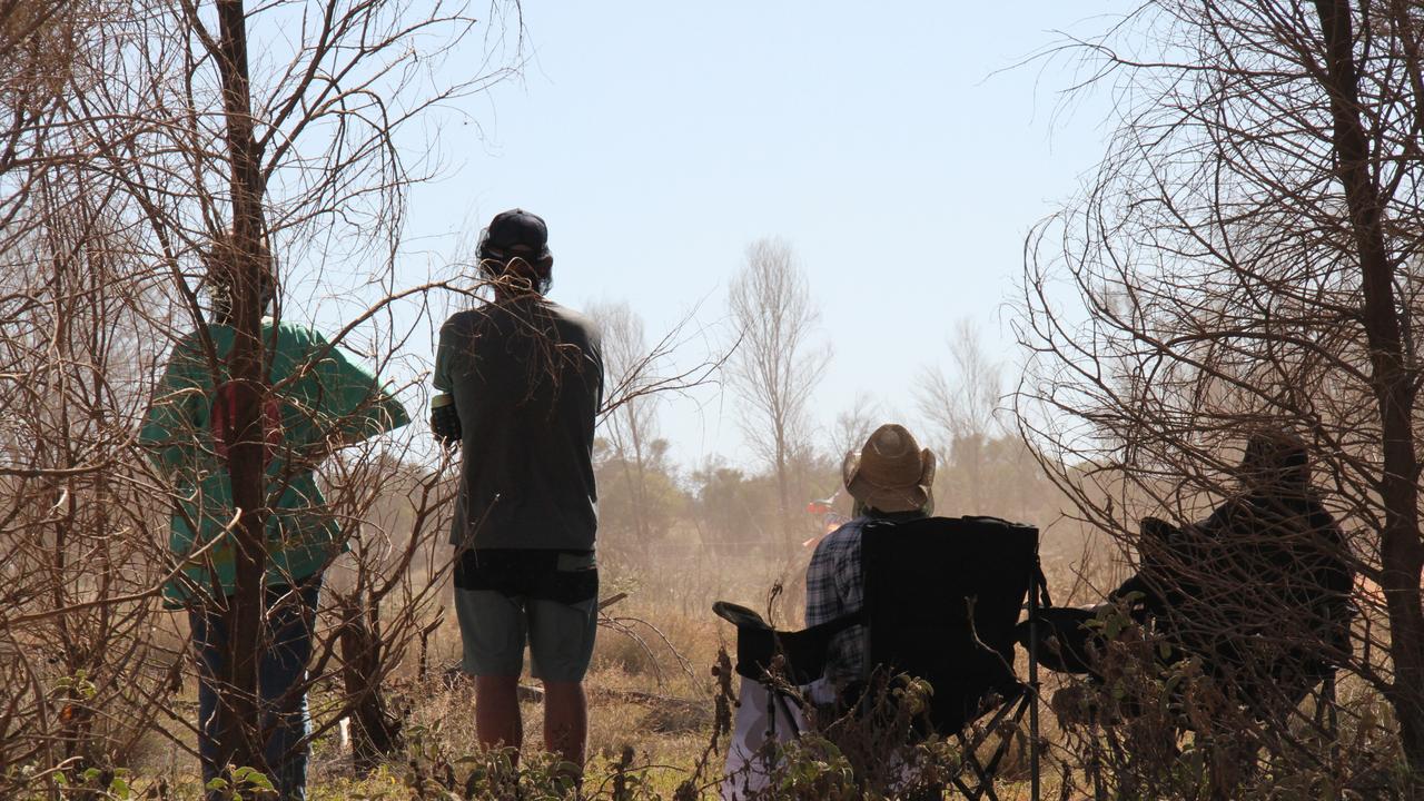 The 2025 Finke Desert Race has begun, with hundreds of punters lining the track south of Alice Springs to catch the action. Picture: Gera Kazakov