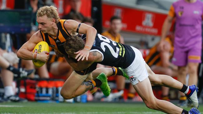 Jimmy Webster brings down Hawk James Worpel. Picture: Michael Willson/AFL Photos via Getty Images)