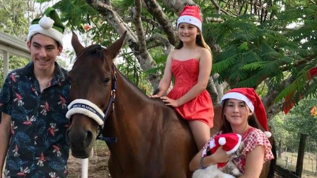 Doonan mum Kylie Rowe said 11-year-old Ryker the horse has ‘won everyone’s hearts’, after he was found malnourished and rescued from a Rockhampton property in 2018. Pictured (left to right) is Jazz, Ruby and Abbey with Ryker. Photo: Kylie Rowe.