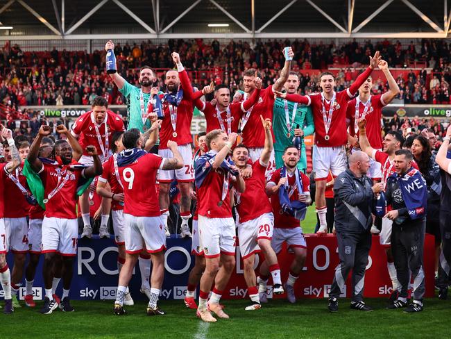 James McClean of Wrexham celebrates winning promotion to the championship with teammates. Picture: Robbie Jay Barratt