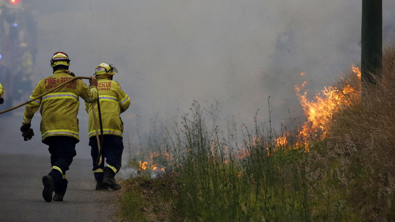 Firefighters work on a controlled burn in Koorainghat, south of Taree in NSW on Monday. Picture: AAP
