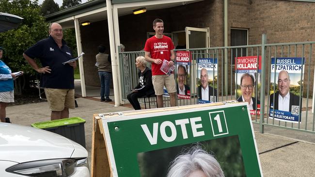 Bega Liberal candidate Russell Fitzpatrick (left) handing out election material at Batemans Bay. Picture: Tom McGann.