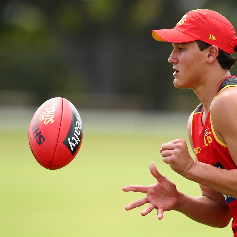 Wil Powell handballs during a Gold Coast Suns AFL media and training session at Metricon Stadium on November 04, 2019 in Gold Coast, Australia. (Photo by Chris Hyde/Getty Images)