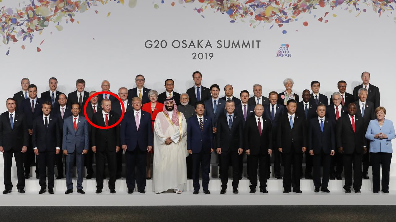 Things are so awkward between US President Donald Trump and Chinese President Xi Jinping (far right) that Turkish President Recep Tayyip Erdoğan (circled) was asked to switch places. Picture: Getty Images