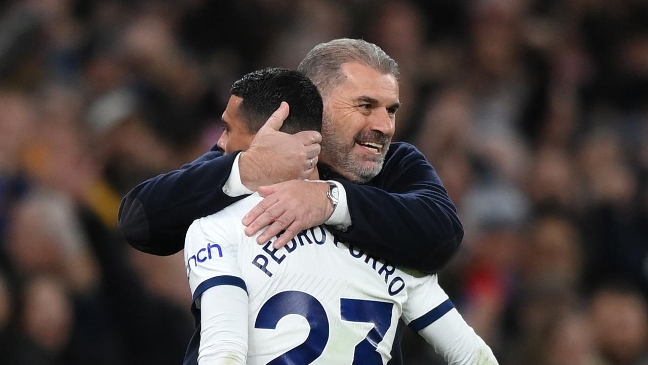 Ange Postecoglou, Manager of Tottenham Hotspur, embraces Pedro Porro. Photo by Justin Setterfield/Getty Images.