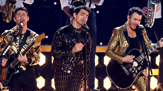 Nick Jonas (left) suffered a social faux pas as old as time. Picture: Getty Images.