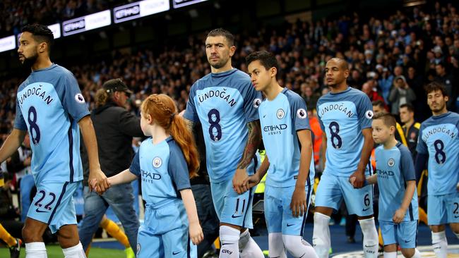 City players show solidarity for injured colleague Ilkay Gundogan.