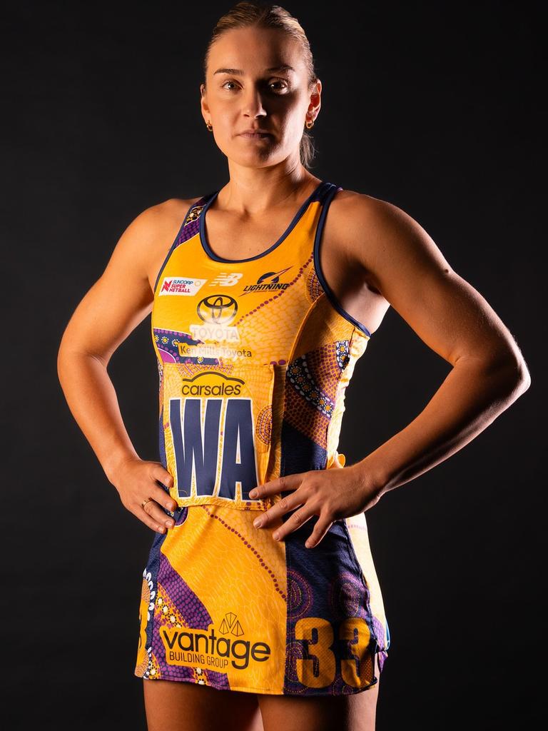 Liz Watson in the Lightning's First Nations Round dress displaying the Toolembi Watama (Storm dance) artwork, hand painted by Kabi Kabi woman Zartisha Davis.