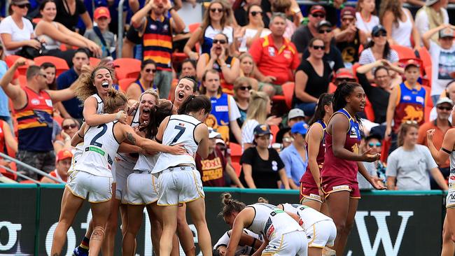 Adelaide players celebrate in front of a packed crowd. Picture: Adam Head