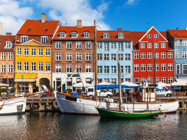 Scenic summer view of color buildings of Nyhavn in Copehnagen, Denmark. Escape - Sat MagWay to Go - Copenhagen Day/NightPhoto: iStock