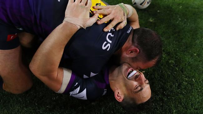 Billy Slater of the Storm and Cameron Smith of the Storm celebrate winning the 2017 NRL grand final.