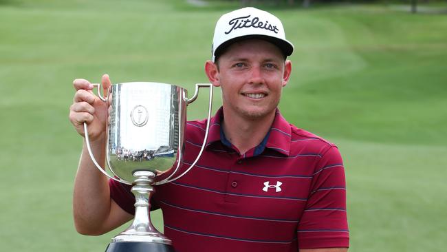Golfer Cameron Smith of Australia poses with the Kirkwood Cup following his victory in the Australian PGA Championship golf tournament at the Royal Pines Resort on the Gold Coast on December 3, 2017. Picture: Patrick Hamilton, AFP.