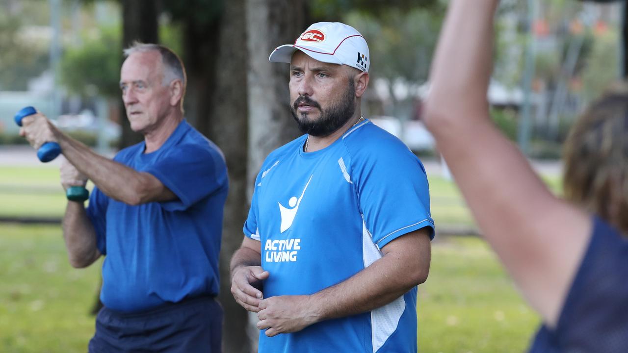 Marc Harbrow leads an outdoor exercise class in Cairns. PICTURE: BRENDAN RADKE