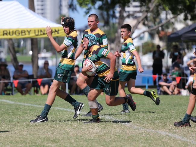 Day Three of King of the Country Junior rugby tournament held at Southport. Under 14'sSurfers Dolphins (green and yellow)  VZMaroochydore Swans. (Blue and Black )Pic Mike Batterham