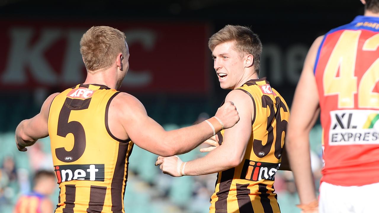 James Worpel and Dylan Moore celebrate a Hawthorn goal.