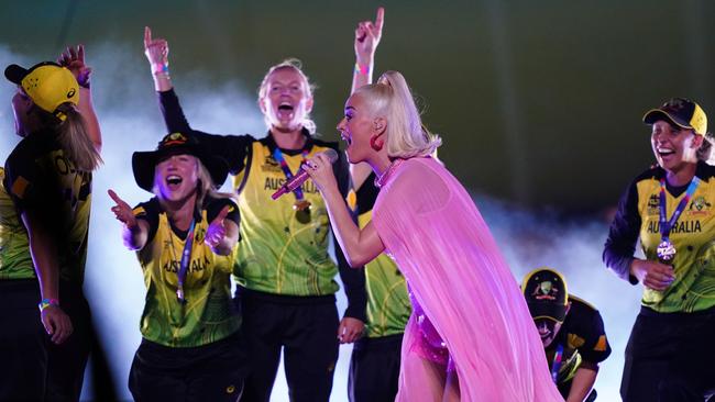 A marvellous moment unfolded when the cricketers joined the pop star. Picture: AAP Image/Scott Barbour