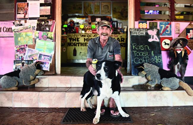 Paddy Moriarty with his dog on the steps out the front of the Larrimah Hotel. Picture: Helen Orr