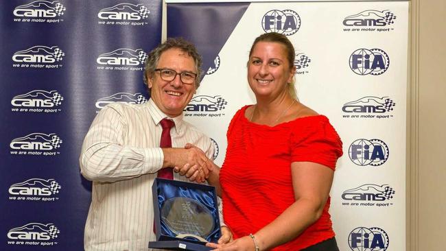 Historic Leyburn Sprints president Tricia Chant (right) receives the CAMS Queensland Motor Sport Event of the Year award from MG Car Club of Queensland Secretary Malcolm Spiden. Picture: Ian Welsh/Shifting Focus)