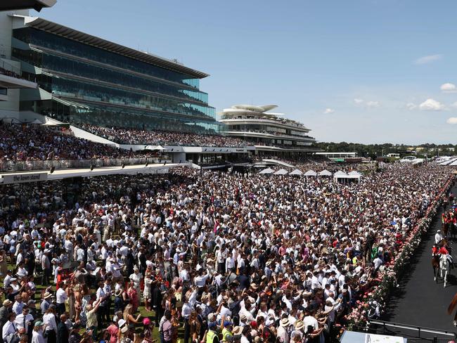 MELBOURNE , AUSTRALIA. November 7, 2023.  Melbourne Cup races at Flemington Racecourse, Melbourne.  Race 7. The Melbourne Cup.    The field heads out for the Melbourne cup infront of huge crowd at Flemington     . Pic: Michael Klein