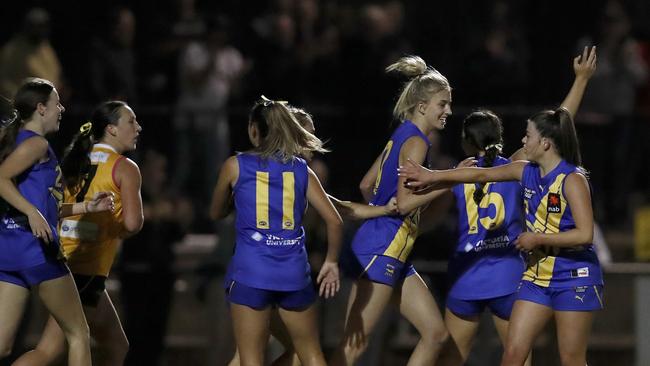 Western Jets players celebrate a goal. Photo: Darrian Traynor/AFL Photos/Getty Images.
