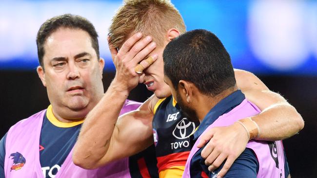 David Mackay leaves the field with concussion. Picture: AAP