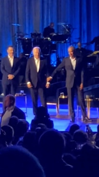 Biden freezes on stage