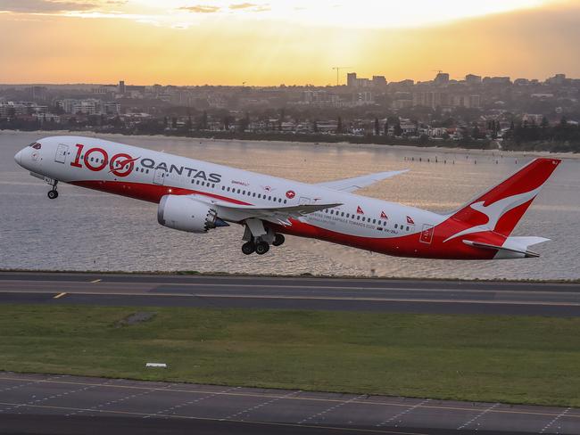 SYDNEY, AUSTRALIA - NOVEMBER 16: A Boeing 787 Dreamliner aircraft, Qantas flight QF100 takes off from Kingsford Smith International airport as part of Qantas 100th Birthday celebrations on November 16, 2020 in Sydney, Australia. Australia's national airline Qantas is celebrating 100 years. (Photo by David Gray#JM/Getty Images for Destination New South Wales/Qantas) *** BESTPIX ***