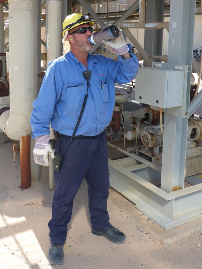 Plant operator Troy Holt has a drink after a day’s work in the Moomba Plant. Picture: Marko Draca