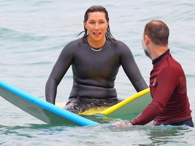 Both wore wetsuits as they floated in the waves. Picture: Backgrid