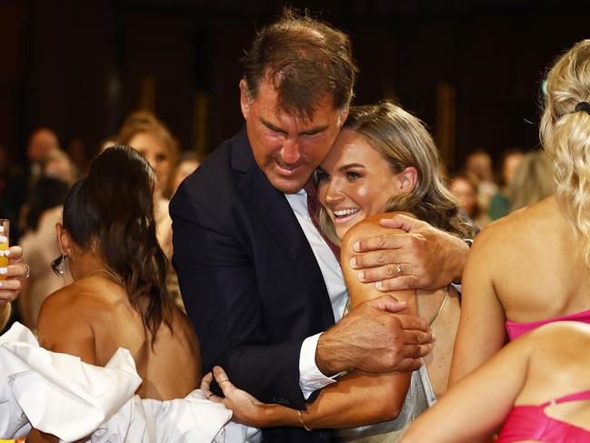 Bates gets a hug from her coach, Craig Starcevich. Picture: AFL Photos/Getty Images