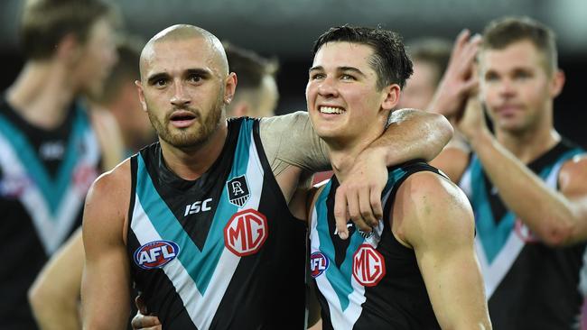 GOLD COAST, AUSTRALIA - SEPTEMBER 05: Sam Powell-Pepper and Connor Rozee of Port Adelaide celebrates victory during the round 16 AFL match between the North Melbourne Kangaroos and the Port Adelaide Power at Metricon Stadium on September 05, 2020 in Gold Coast, Australia. (Photo by Matt Roberts/AFL Photos/via Getty Images)