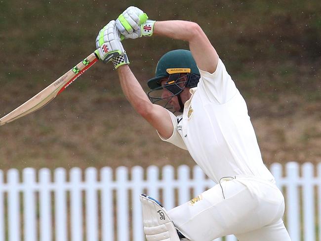 Mark Phelan punches a straight boundary for Northcote. Picture: Hamish Blair