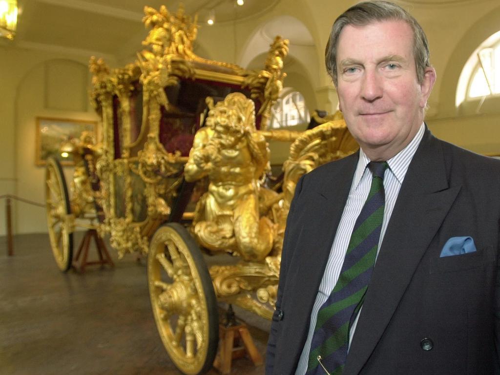 June 15, 2001: Sir Michael Parker, organiser of the Golden Jubilee celebrations, stands in front of the Gold State Coach in the Royal Mews London. The Coach, built for King George III will be used for the first time since the Queen's Silver Jubilee in 1977.