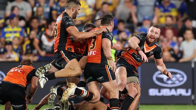 Jackson Hastings was swamped by teammates after securing the Tigers first win of the season. Picture: Cameron Spencer/Getty Images