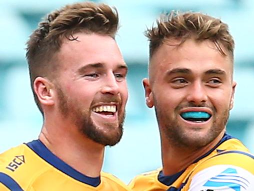 SYDNEY, AUSTRALIA - MARCH 24: Clint Gutherson of the Eels celebrates with teammates after scoring a try during the round two NRL match between the Canterbury Bulldogs and the Parramatta Eels at ANZ Stadium on March 24, 2019 in Sydney, Australia. (Photo by Jason McCawley/Getty Images)