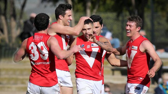 SANFL game between North Adelaide and the Eagles at Prospect Oval. Robbie Young kicks a goal in the second quarter, and celebrates with team mates. Picture: Dean Martin