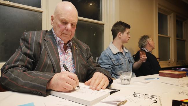 Julian Punch signing copies of his book, <i>Gay with God: The Life and Times of a Turbulent Priest</i>, at a recent launch in Hobart. Picture: MATHEW FARRELL