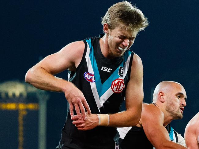 ADELAIDE, AUSTRALIA - JULY 25: Todd Marshall of the Power holds his right thumb after contact during the round 8 AFL match between Port Adelaide Power and the St Kilda Saints at Adelaide Oval on July 25, 2020 in Adelaide, Australia. (Photo by Daniel Kalisz/Getty Images)