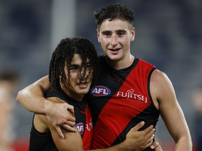 NCA. MELBOURNE, AUSTRALIA. 25th February, 2025 . AFL.  AAMI Community Series. Geelong vs Essendon at GMHBA Stadium.   Isaac Kako hugs Elijah Tsatas after tonights win over Geelong  .  Picture: Michael Klein