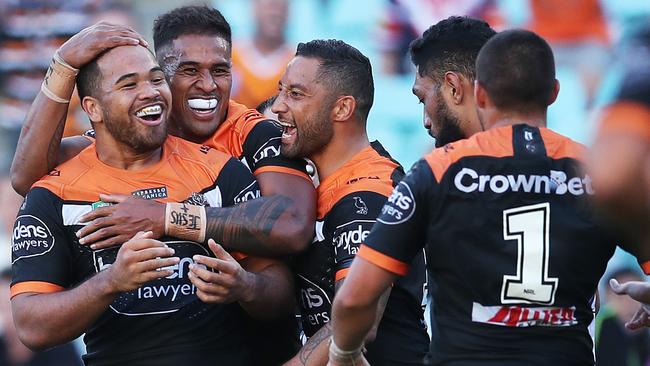 West Tigers players celebrate Esan Marsters, Michael Chee Kam and Benji Marshall celebrate a try.