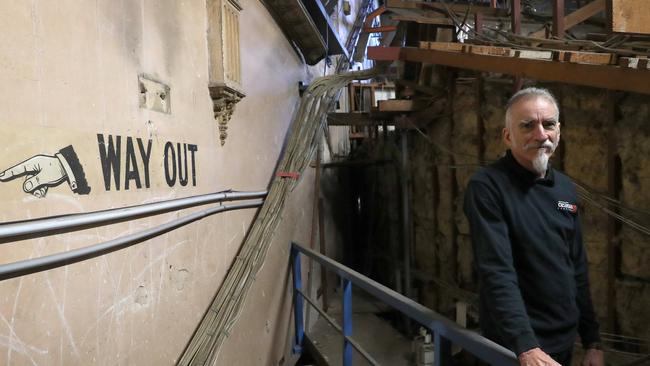 Her Majesty's Theatre lighting technician Fred Schultz, up above the stage where parts of the original building from 1913 can still be seen. Picture: Dean Martin