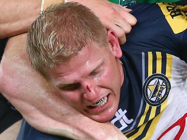 SYDNEY, AUSTRALIA - APRIL 13: George Burgess, Chris McQueen and Issac Luke of the Rabbitohs tackle Ben Hannant of the Cowboys during the round six NRL match between the South Sydney Rabbitohs and the North Queensland Cowboys at ANZ Stadium on April 13, 2015 in Sydney, Australia. (Photo by Mark Kolbe/Getty Images)