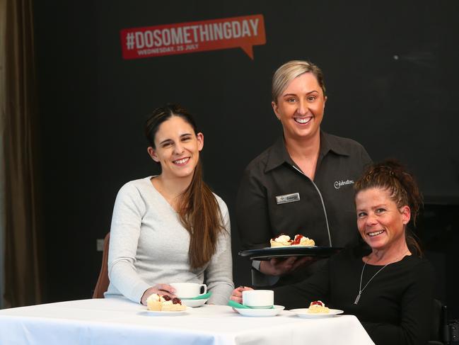 Club Toukley RSL provided refreshments for disability group VOICCD today, including  representatives Steph Travers and Emma Fergusson. Club Toukley’s Georgy Byrnes in the centre. Picture: AAP /Sue Graham.