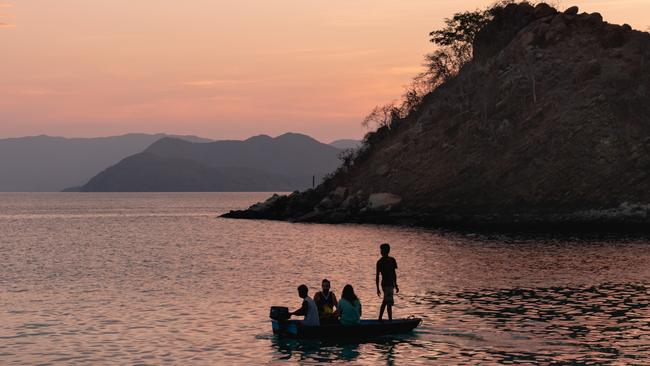 EMBARGO FOR TWAM, 15 FEBRUARY 2025. FEE MAY APPLY. Guests on the beach, Komodo Islands, Seven day Spice Islands and Coral Triangle cruise with Aqua Expeditions (Aqua Blu Yacht). Photo: Supplied