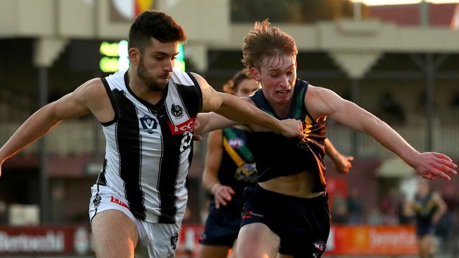 MELBOURNE, AUSTRALIA - MAY 21: Billy Drake of Collingwood and Max Michalanney of the NAB AFL Academy competes for the ball during the match between the AFL Academy and Collingwood Magpies at Skybus Stadium on May 21, 2022 in Melbourne, Australia. (Photo by Kelly Defina/AFL Photos/Getty Images)