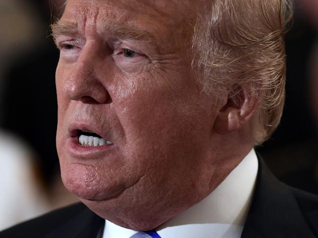 President Donald Trump responds to a reporters question during an event with sheriffs in the East Room of the White House in Washington, Wednesday, Sept. 5, 2018. (AP Photo/Susan Walsh)