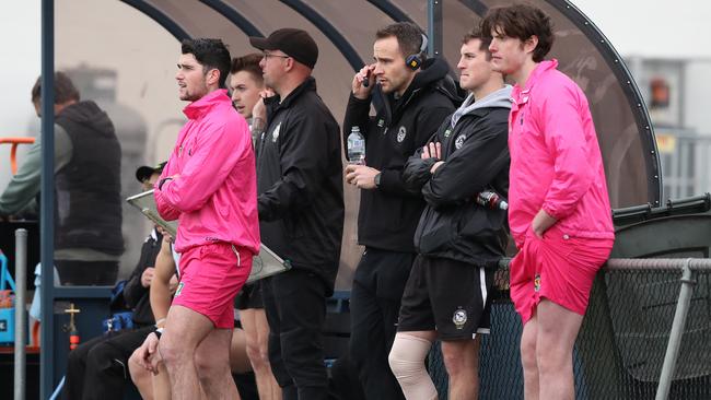 Jaye Bowden (centre) helps out from the sidelines during last week’s TSL opener between Glenorchy and Launceston. Picture: NIKKI DAVIS-JONES