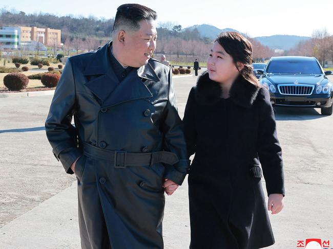 The pair held hands during the ceremony. Picture: KCNA VIA KNS / AFP.